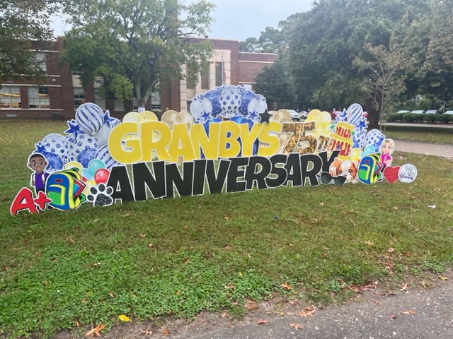  A decorative sign that indicates Granby Elementarys 75th Anniversary